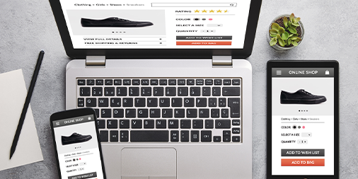 Online shop for black trainers on laptop, tablet and smartphone screen