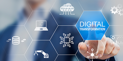 Man pressing digital transformation lit up in blue on digital screen.