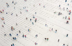 Crowd walking over binary code