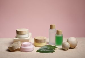 Different organic beauty products with wooden decoration