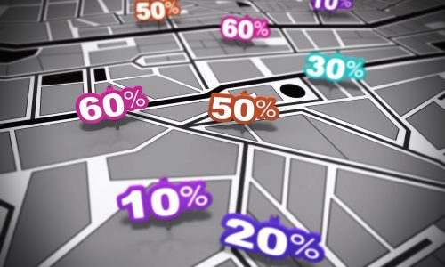 Many percent signs in different colours over a #000000 city map with focus effect