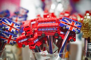 Selective focus, souvenir pencils decorated with double decker bus on display at Camden market in London